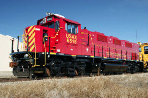 A locomotive on a set of railroad tracks.