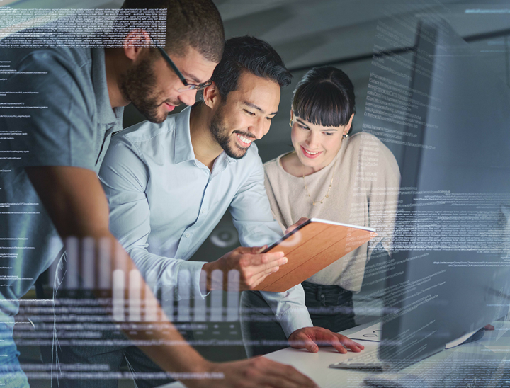 Three people looking at a computer together