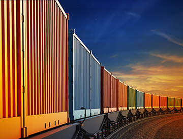 Wagon of freight train with containers on the sky background (Adobe Stock/artegorov3@gmail) 