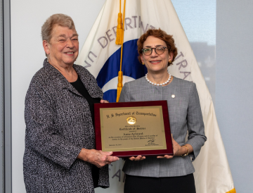 Anne Aylward with U.S. DOT Deputy Secretary Polly Trottenberg at U.S. DOT Volpe Center Town Hall – September 10, 2024  