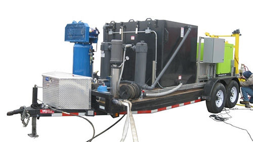The DOTWASH system cleans invasive species from trucks and construction equipment. (S-K Environmental photo) The DOTWASH system, which sits on a trailer and can be towed behind a pickup truck.