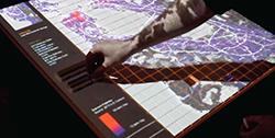 A person interacts with a map visual interface to estimate freight logistics.