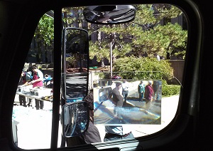 Three side mirror types and a Fresnel lens, all designed to mitigate the right-side blind spot of a large truck, were viewable by demo attendees from the driver’s seat of a Boston DPW truck.