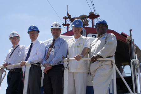 Group photo. From left to right: John Tunna, FRA Director of Research and Development; Robert Johns, Volpe Center Director; David Tyrell, Volpe Principal Technical Advisor on train crashworthiness; Dr. Kevin Womack, RITA Associate Administrator; and Greg Winfree, RITA Deputy Administrator at the Transportation Technology Center (TTCI) in Pueblo, Colorado. (Volpe Photo)