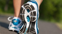 Close-up of shoes of a person walking