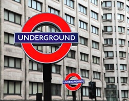 A sign featuring London's Underground transit logo.