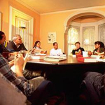 People sitting at a table in conversation