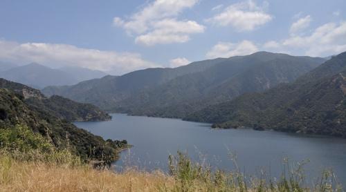 Scenic view of a waterway with mountains on either side.