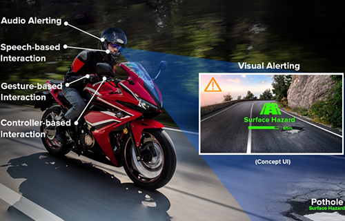 A motorcyclist is alerted to a pothole on the road ahead via the BARRACUDA app.