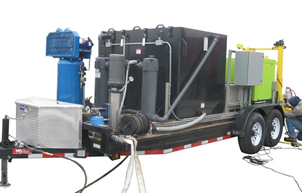 The DOTWASH system, which sits on a trailer and can be towed behind a pickup truck.