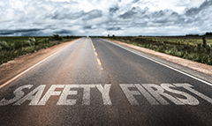 An image of a road with the words SAFETY FIRST.