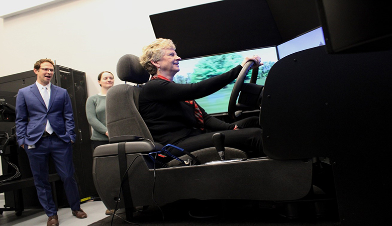Image of Carnahan driving FRA's Behavior and Railroad Crossings (B-RX) simulator