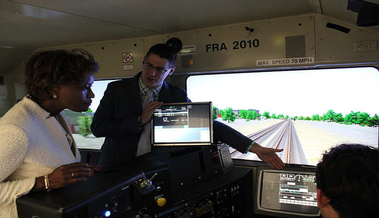 Image of FTA Administrator getting tour of CTIL in the Human Factors Lab