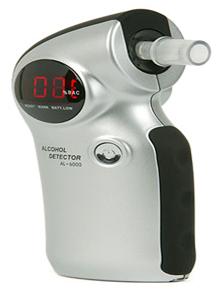 A hand-held breath tester that a user can blow into and receive a digital numeric reading from.