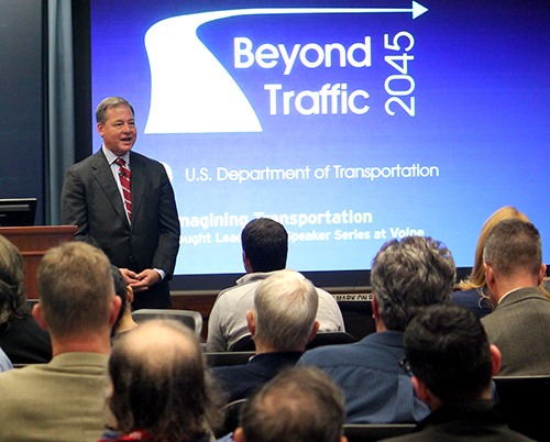 Harry Lightsey speaks to a crowd at Volpe during his talk for Beyond Traffic 2045: Reimagining Transportation.