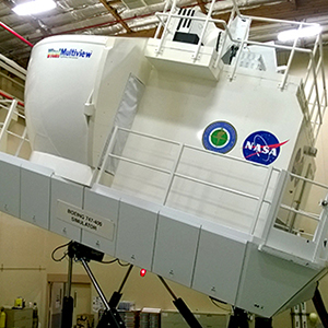 A photo of a simulator cab at NASA Ames tilting upwards to create a “pitch-up” scenario that is known to cause spatial disorient