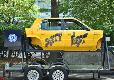 A rollover simulator; a truck body that has "safety first" painted on it.