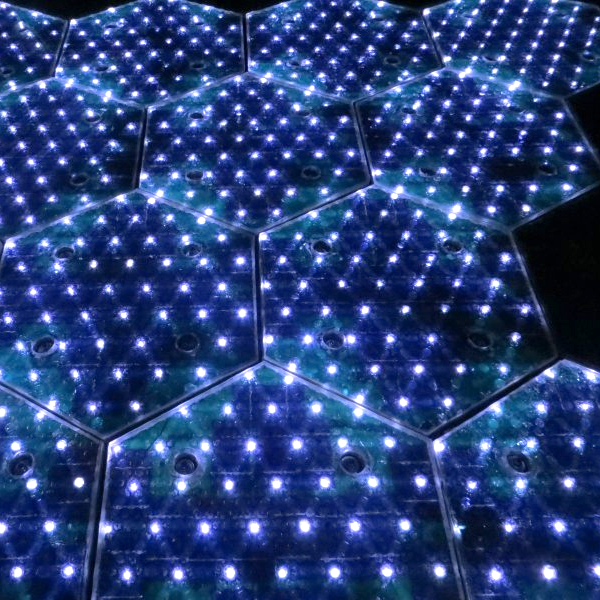 Hexagonal, lit-up solar road panels.
