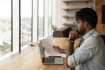 Guy studying computer screen