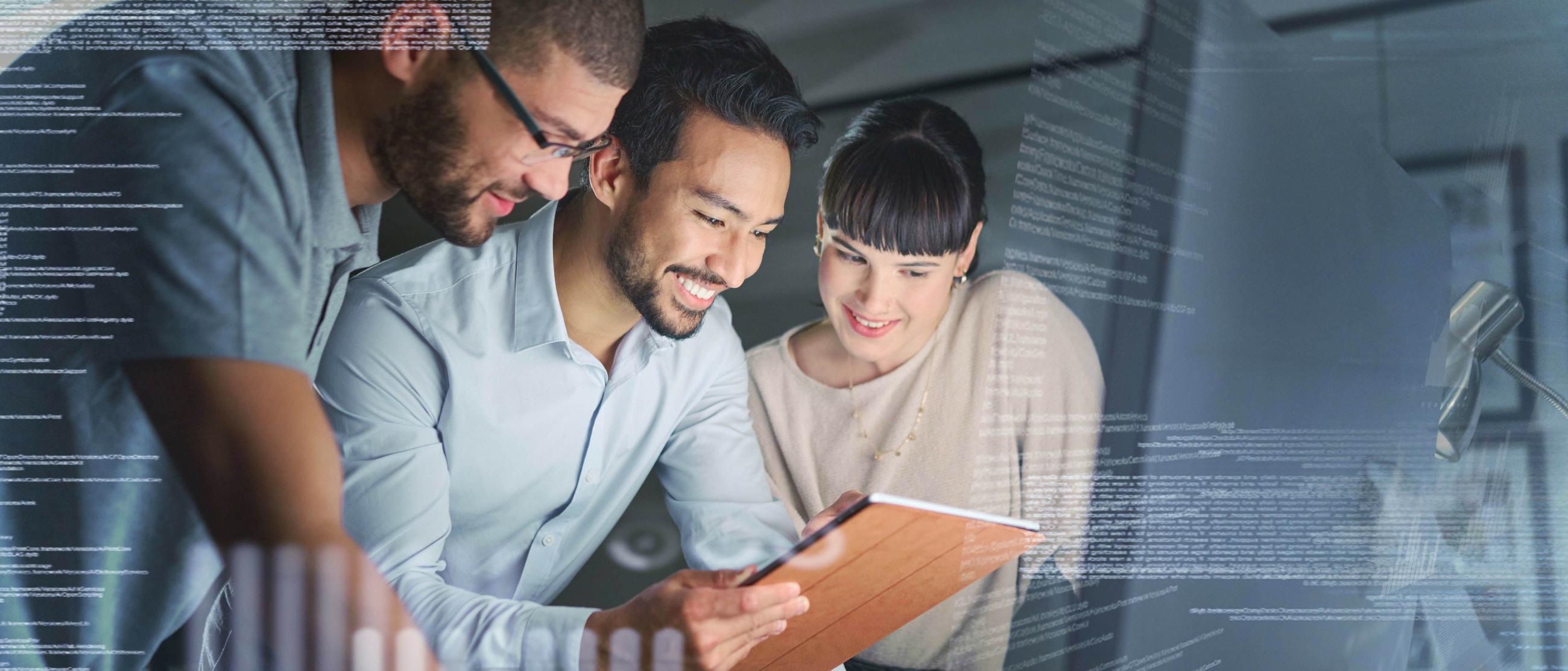 Three people looking at a computer together