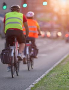 Cyclists biking in a bike lane