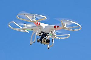 An aerial drone with a camera mounted on it.