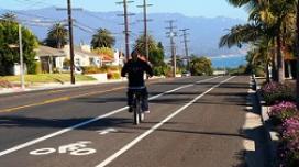 Active transportation, which supports healthy activities like walking and bicycling, is a primary consideration for the California Department of Transportation’s (Caltrans) planning work. Caltrans is one of five state DOTs highlighted in this new report. A bicyclist travels along a dedicated bike lane on a paved road in California.