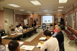 Stakeholders sit around a table at a presentation for the Baltimore-Washington Parkway.
