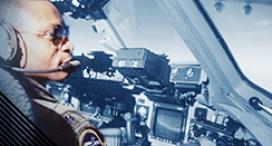 General Darren W. McDew in the cockpit of an airplane.