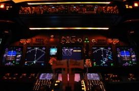 The instrument panel of a modern Boeing 737-800 airliner at night.
