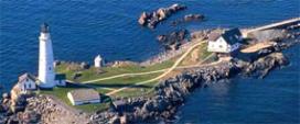 A lighthouse and hosue on a small island