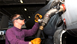 A technician loads an aircraft with jet fuel.