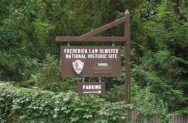 A wooden sign at the entrance of the park