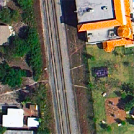 Photo from Google Maps showing a shortcut across the tracks near a Boys and Girls Club. Photo from Google Maps showing a shortcut across the tracks near a Boys and Girls Club.
