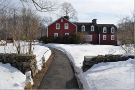 A red building surrounded by snow